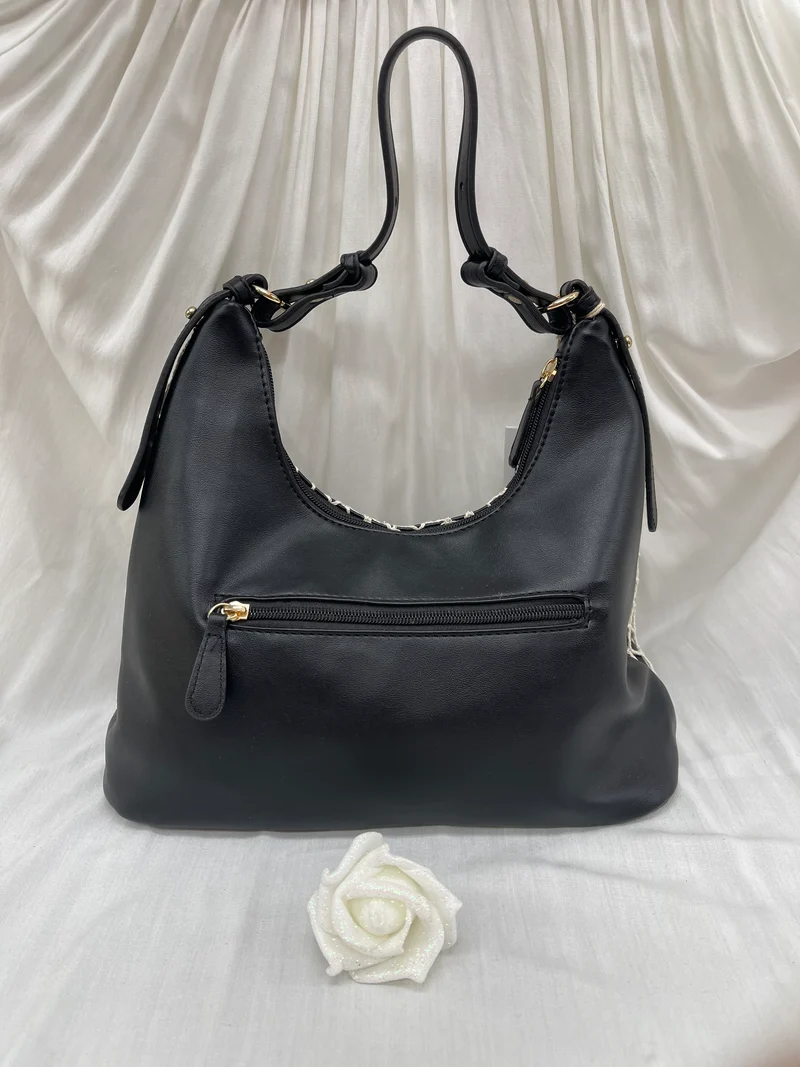 Sac noir avec détails en filet blanc - Élégance audacieuse