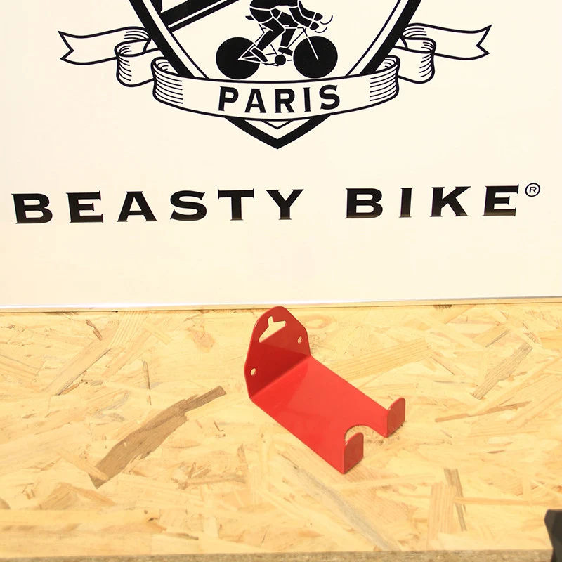 Wall-mounted bike rack with pedal attachment
