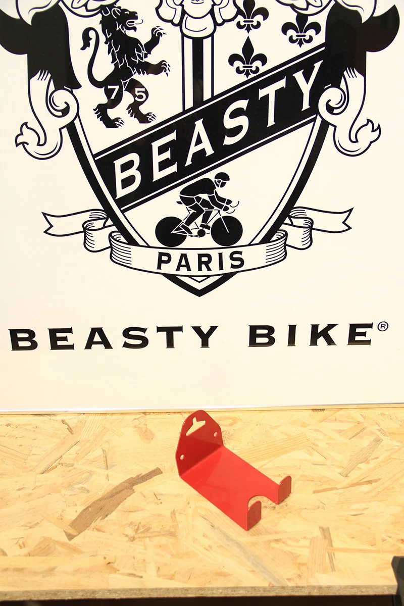 Wall-mounted bike rack with pedal attachment