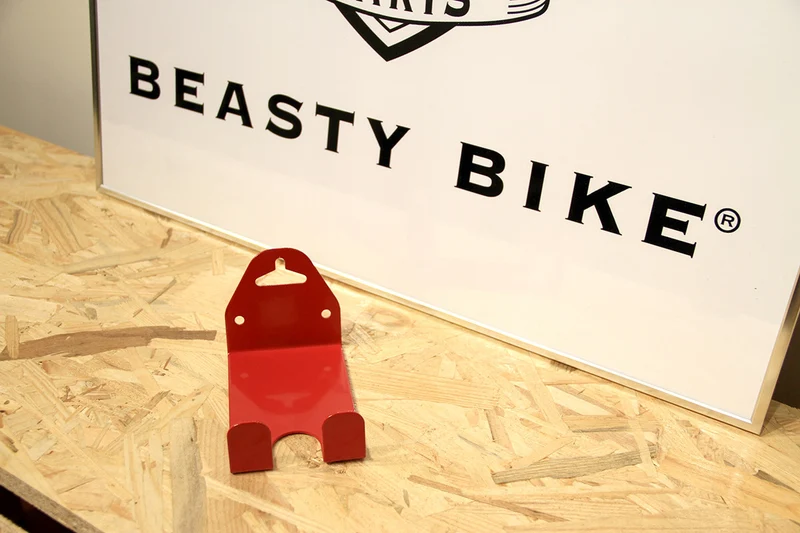 Wall-mounted bike rack with pedal attachment