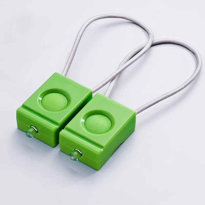 Pair of green Bookman bicycle lamps
