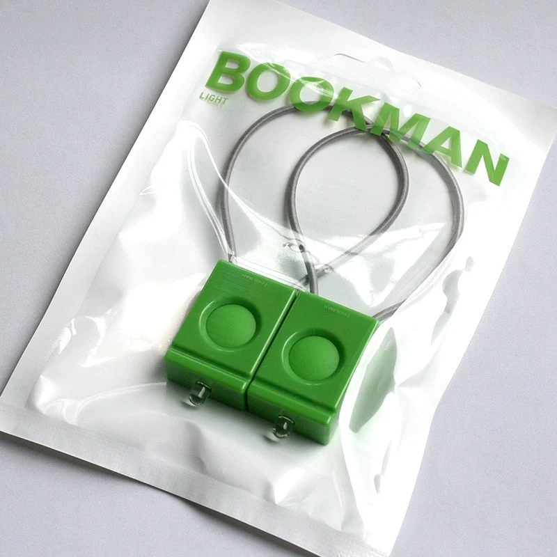 Pair of green Bookman bicycle lamps